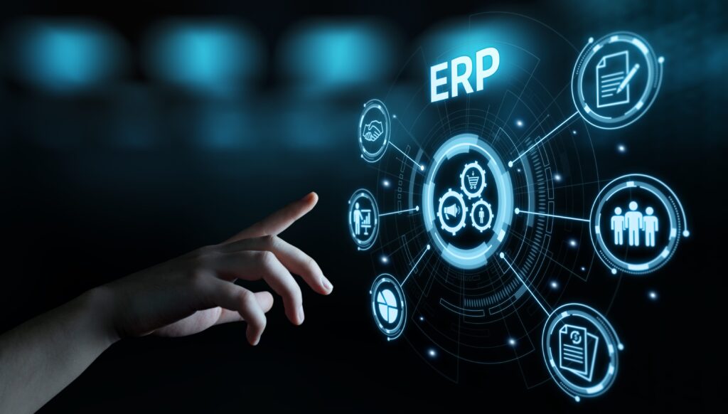 Hand pointing at a digital ERP interface with icons representing business operations such as finance, human resources, and supply chain management.